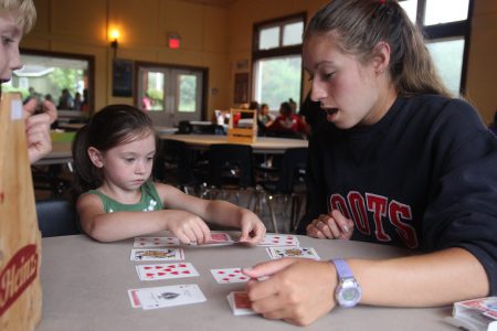 Camper and staff playing cards at Arrowhead Camp.