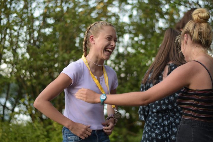 Girl camper getting an award at Arrowhead Camp.