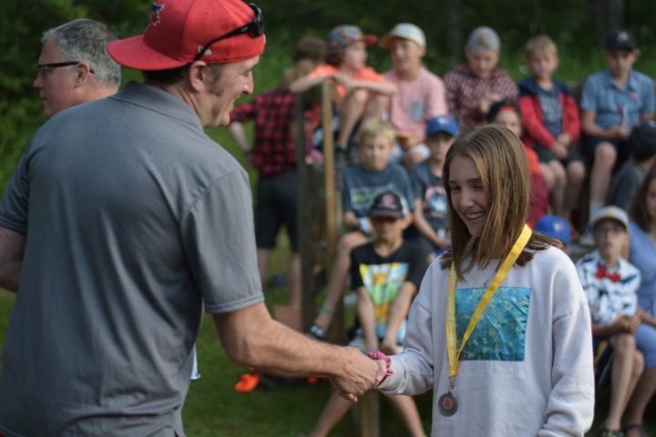 Pat Handing out an award at Arrowhead Camp.